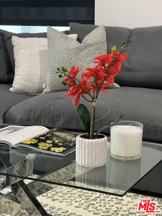124 South Croft Avenue, Unit 101 Los Angeles, CA 90048 - Photo 22 of 22 a vase of flowers sitting on a table