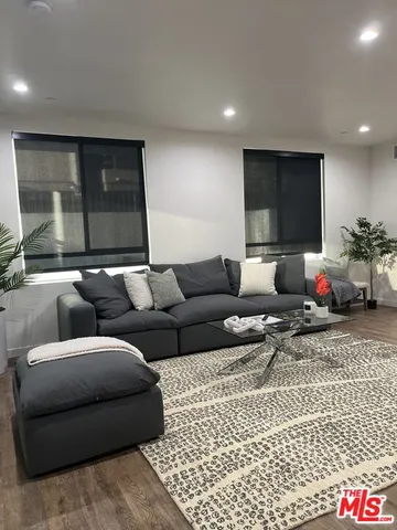 a living room with furniture and a rug