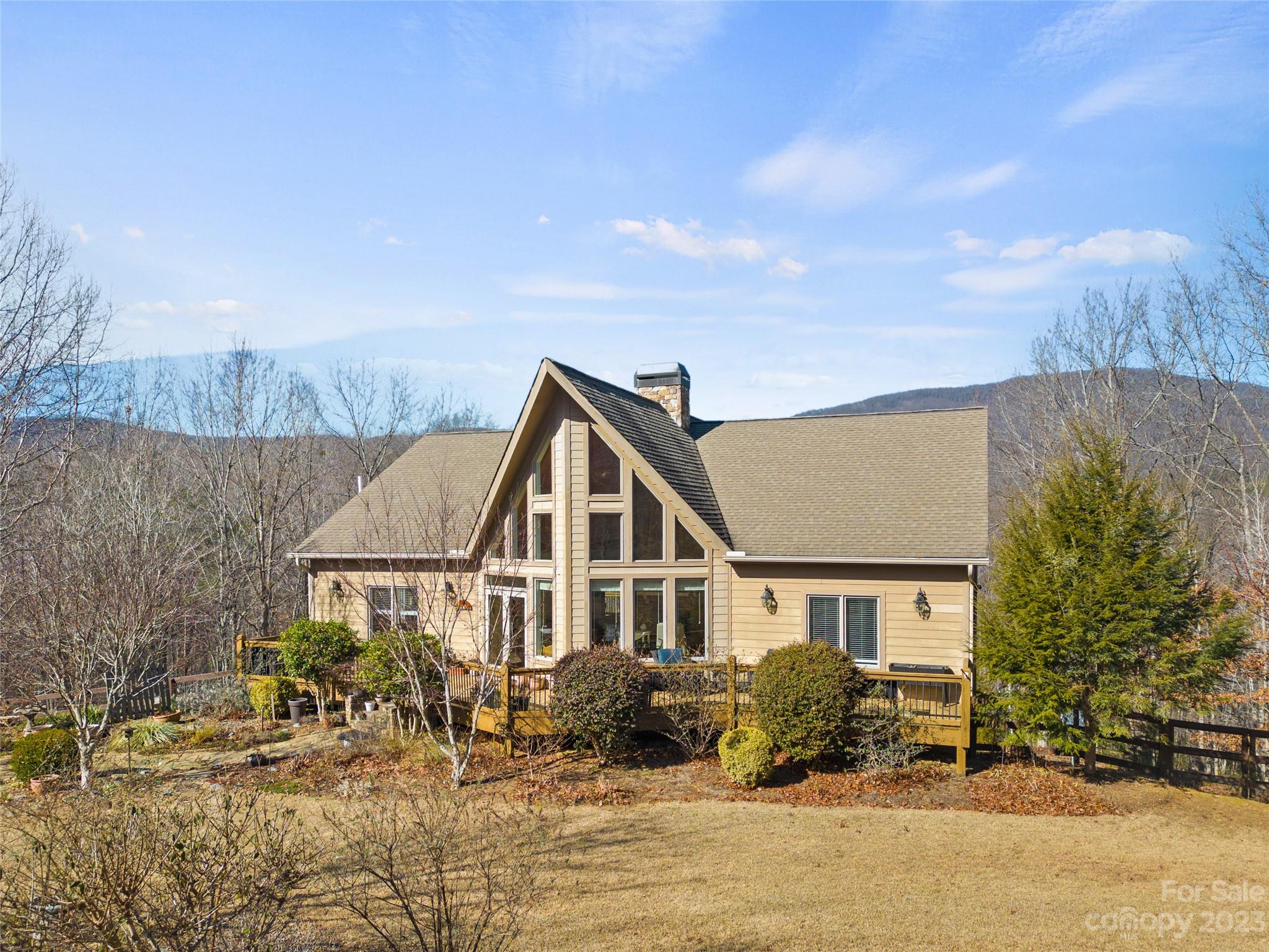 340 Highland View Lane Mill Spring, NC 28756 - Photo 2 of 48 a front view of a house with a yard