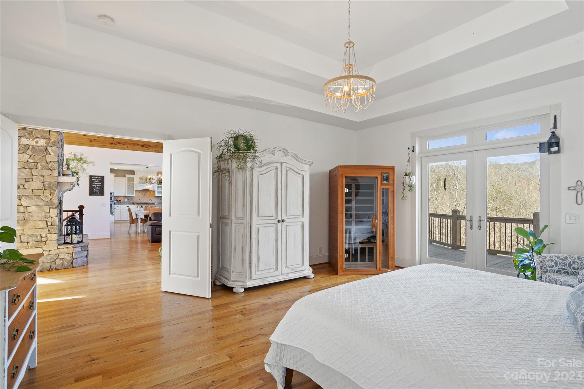 340 Highland View Lane Mill Spring, NC 28756 - Photo 21 of 48 a bedroom with furniture and a chandelier