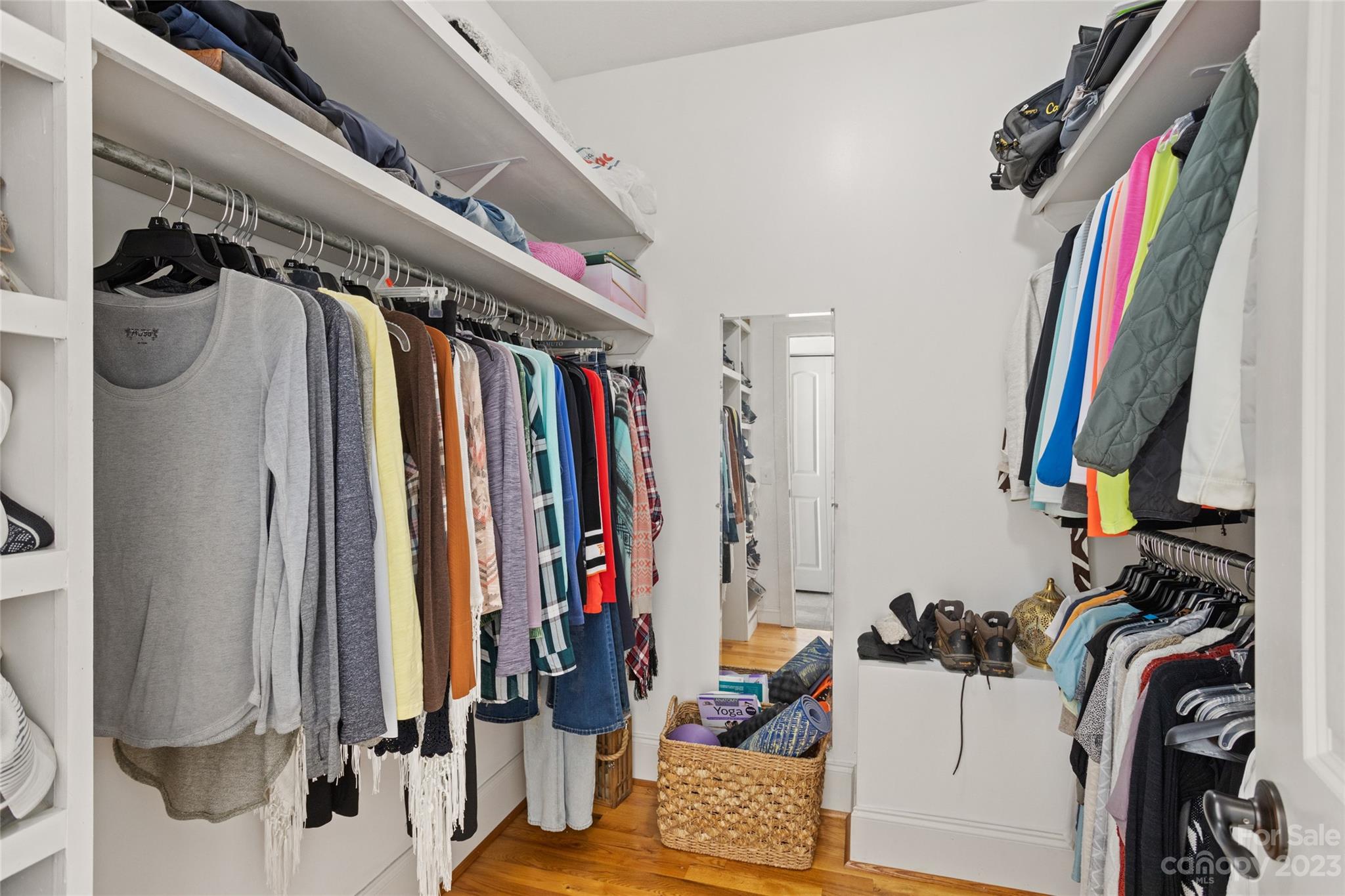 340 Highland View Lane Mill Spring, NC 28756 - Photo 22 of 48 a view of walk in closet with clothes and shoes