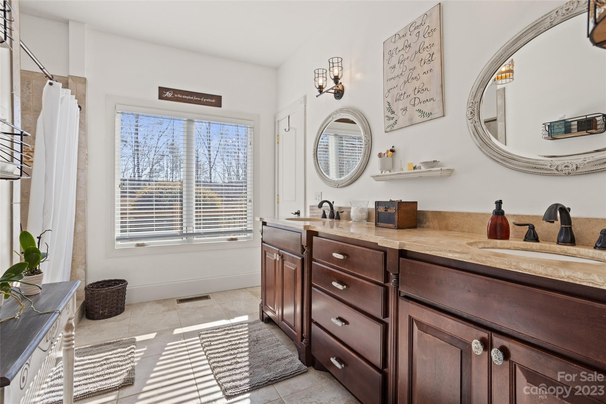 340 Highland View Lane Mill Spring, NC 28756 - Photo 23 of 48 a bathroom with a granite countertop sink and a mirror