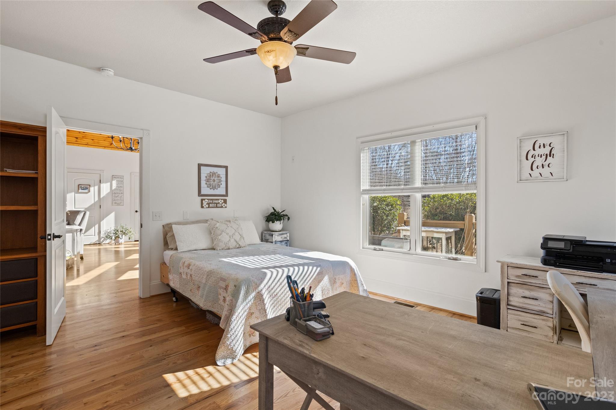 340 Highland View Lane Mill Spring, NC 28756 - Photo 26 of 48 a bedroom with a bed and a table in it