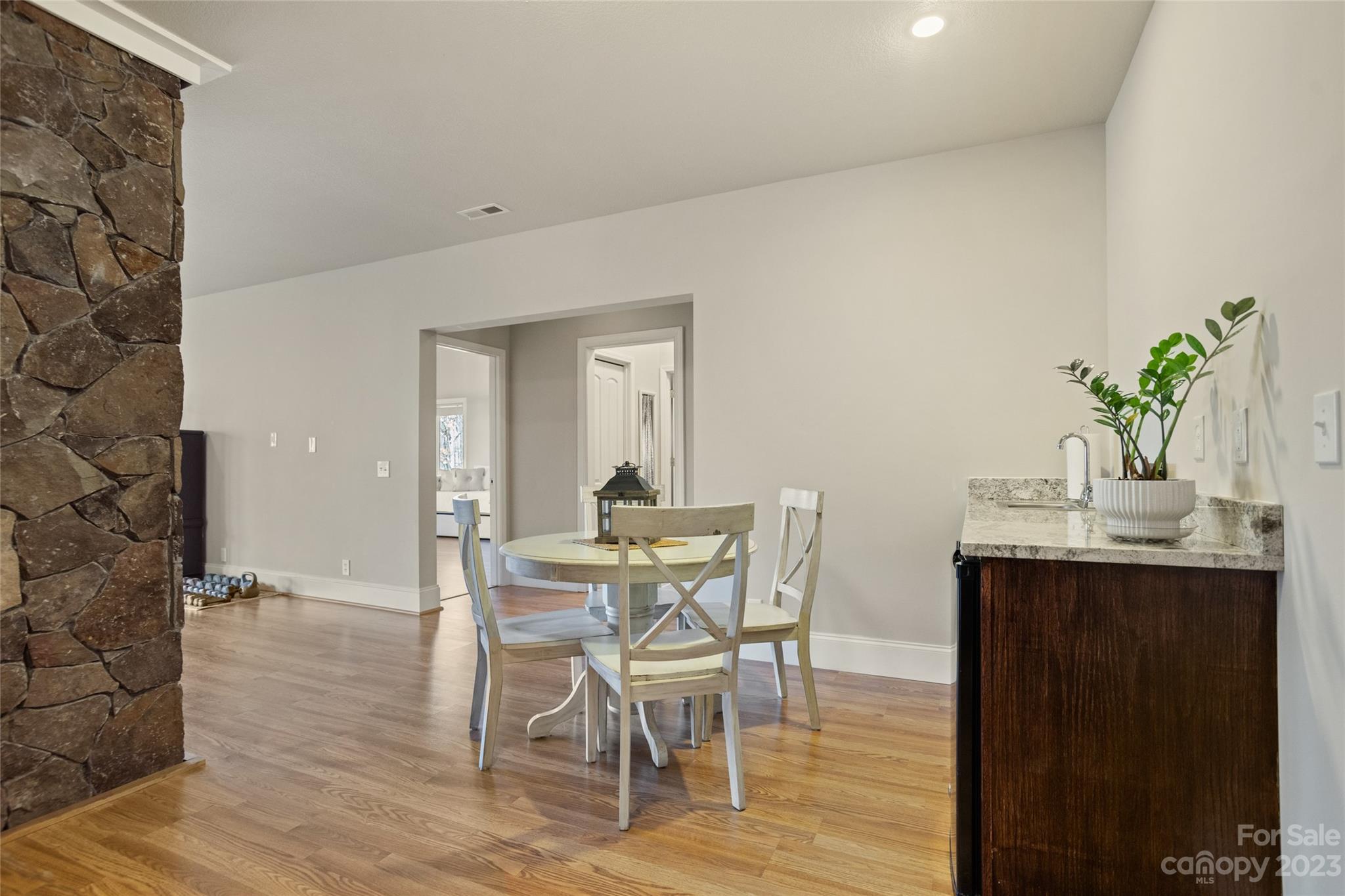 340 Highland View Lane Mill Spring, NC 28756 - Photo 29 of 48 a view of a dining room with furniture and wooden floor