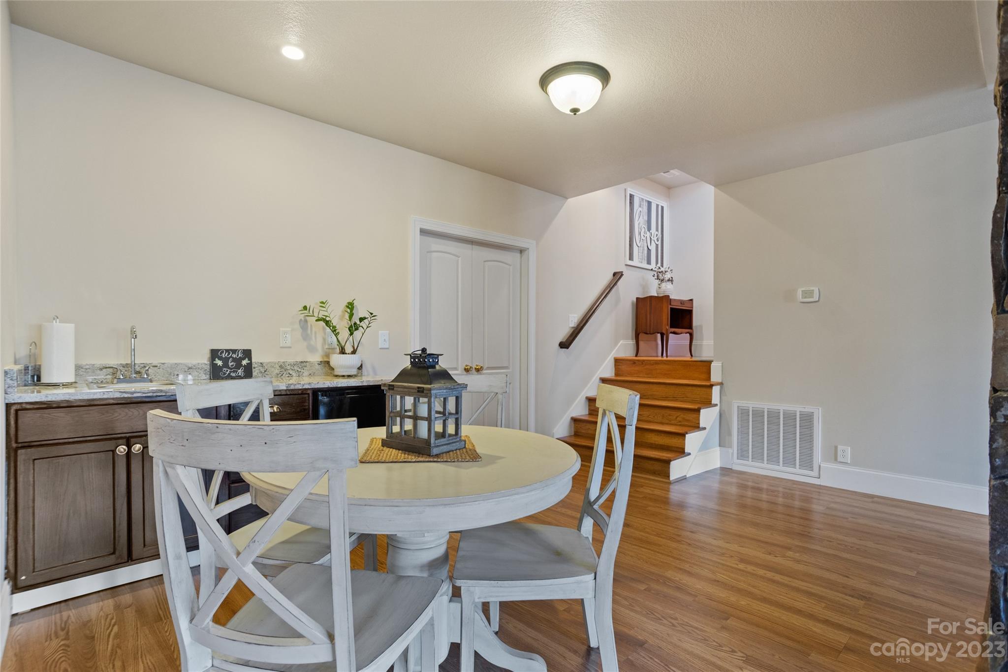 340 Highland View Lane Mill Spring, NC 28756 - Photo 30 of 48 a view of a dining room with furniture and wooden floor