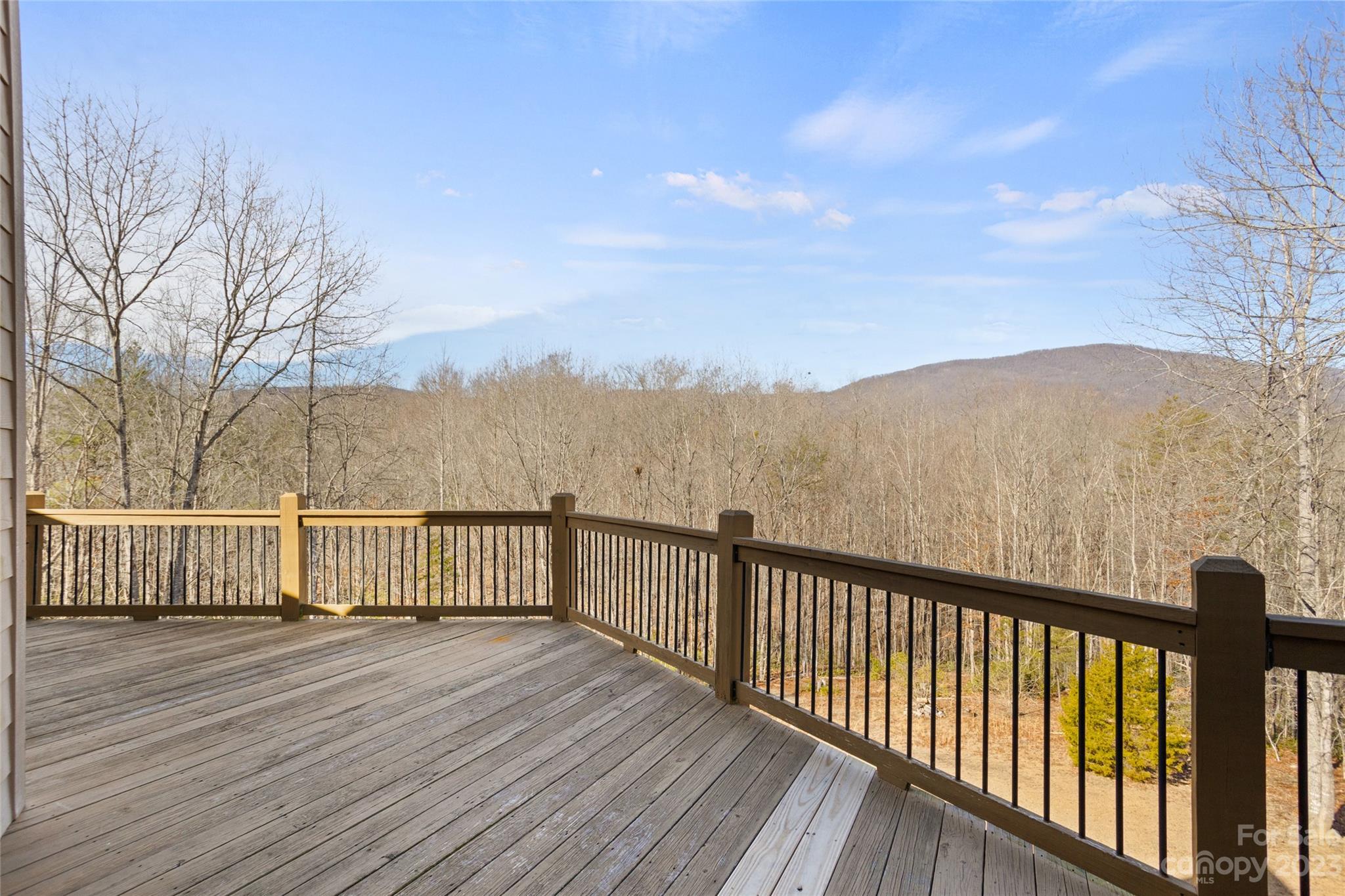 340 Highland View Lane Mill Spring, NC 28756 - Photo 37 of 48 a view of a balcony with wooden floor and fence