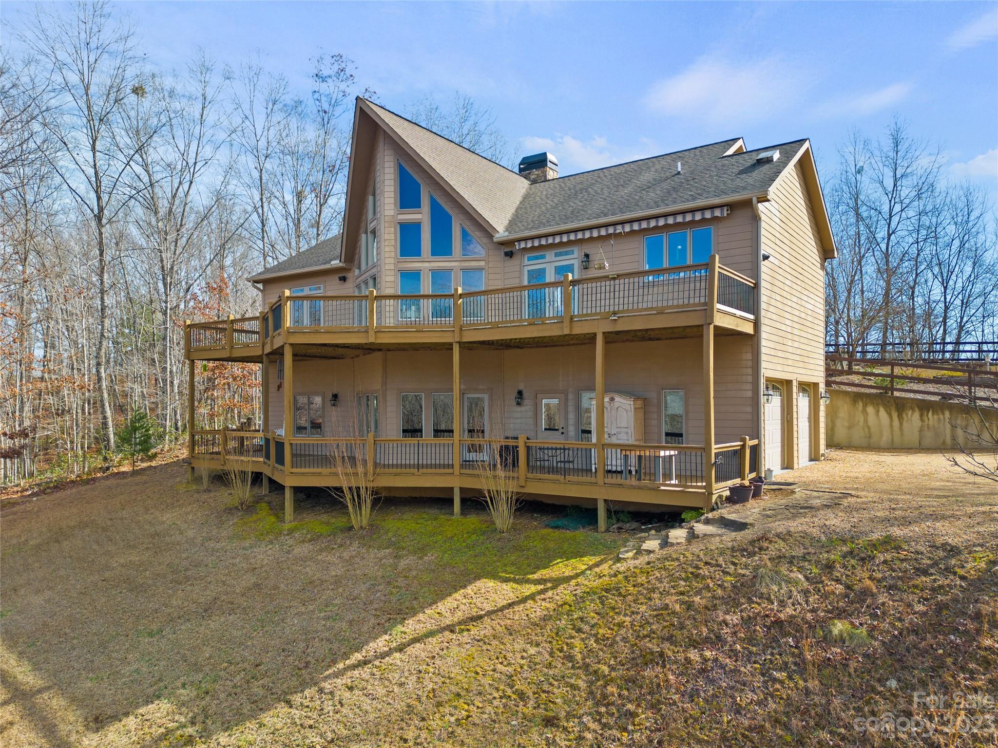 340 Highland View Lane Mill Spring, NC 28756 - Photo 39 of 48 a view of a house with a yard and sitting area