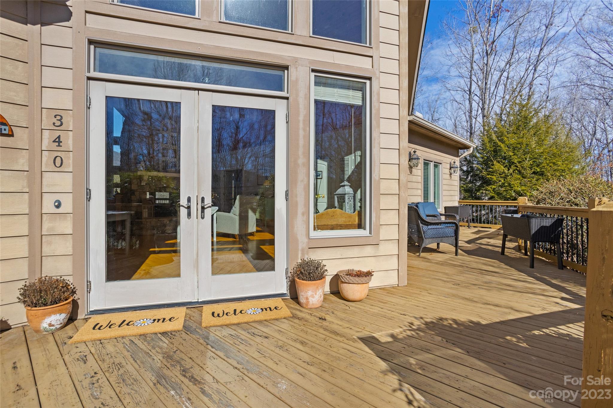 340 Highland View Lane Mill Spring, NC 28756 - Photo 7 of 48 a view of a dinning tables and chairs in the patio of the house