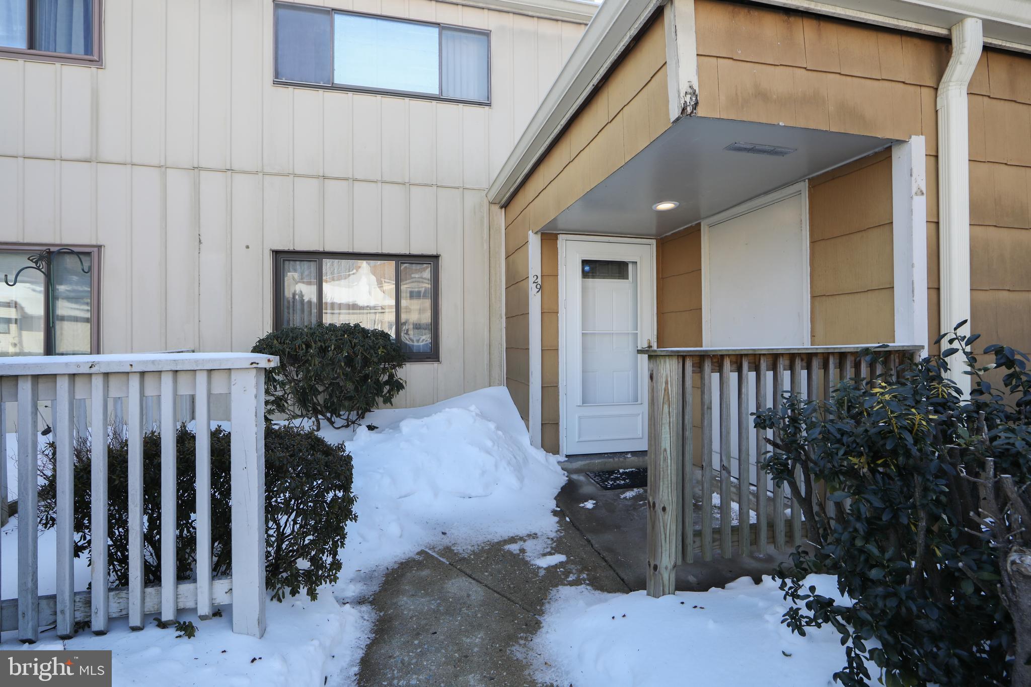 29 Chiswick Drive Lindenwold, NJ 08021 - Photo 25 of 26 a view of a porch with potted plants