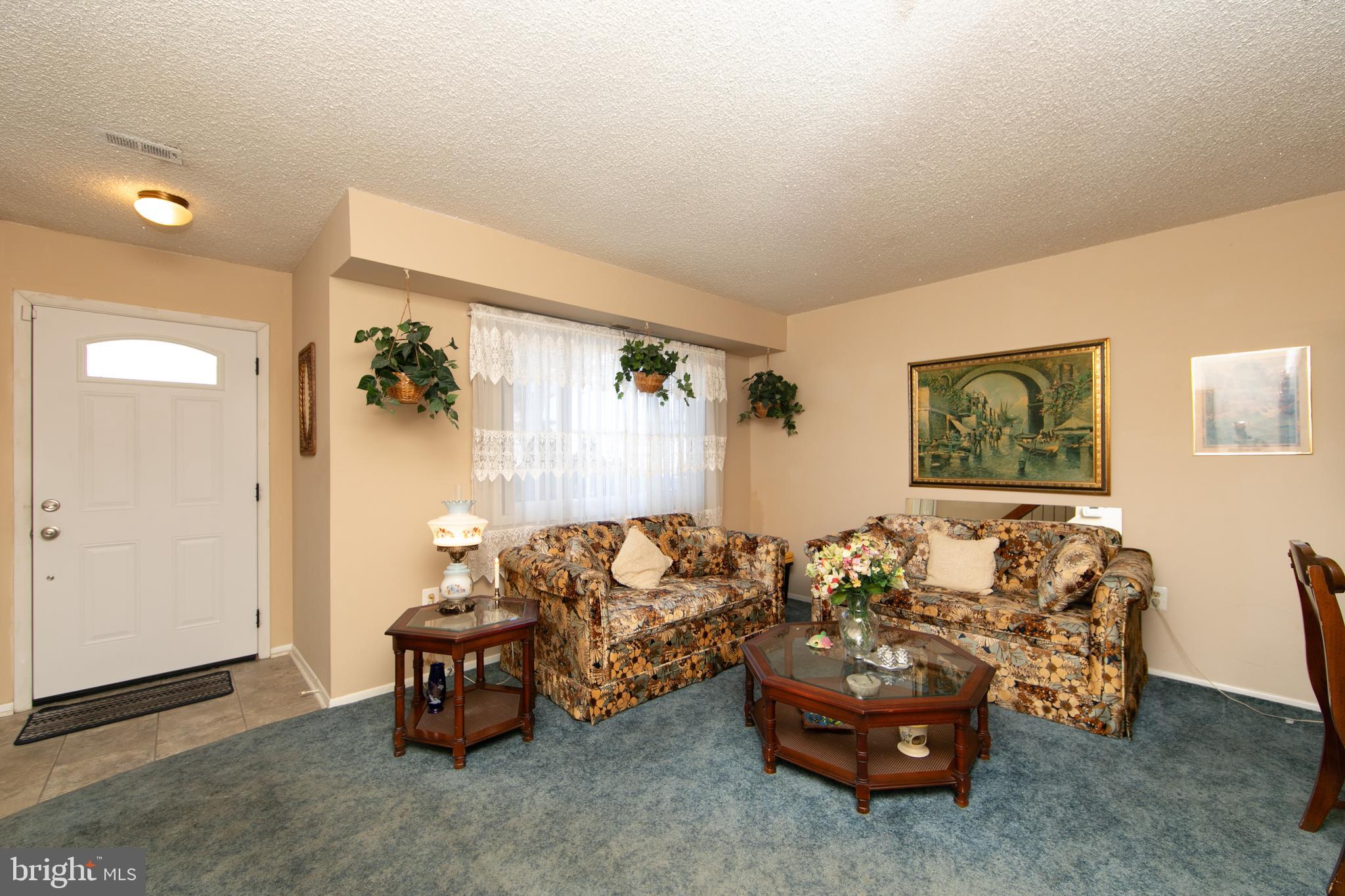 29 Chiswick Drive Lindenwold, NJ 08021 - Photo 3 of 26 a living room with furniture and a window