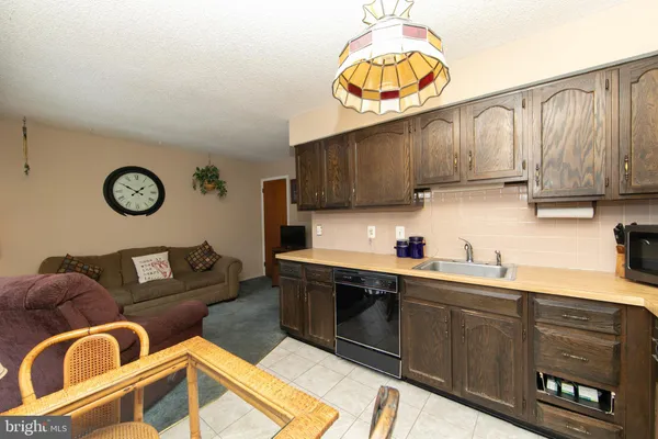 a kitchen with a sink cabinets and window