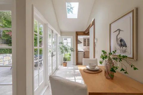 a bedroom with a bed and a night stand