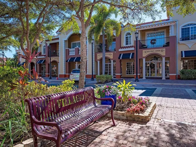 a view of a house with a chairs in a patio