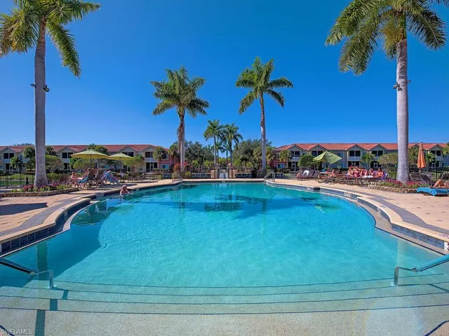 a view of a swimming pool and a yard