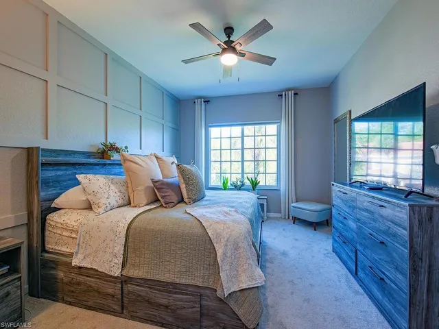 a bed room with a bed and a window