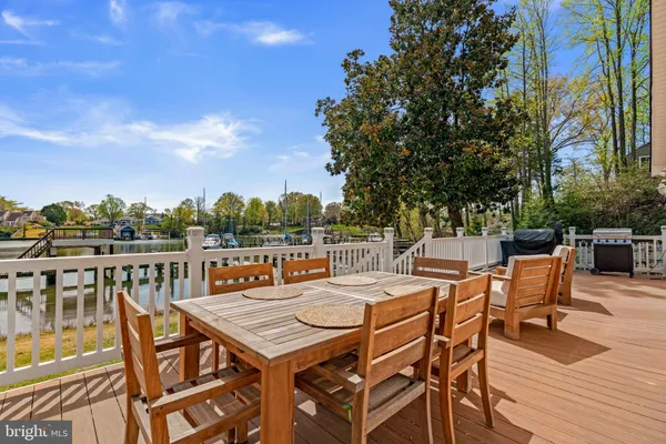 a view of a chair and tables on the patio