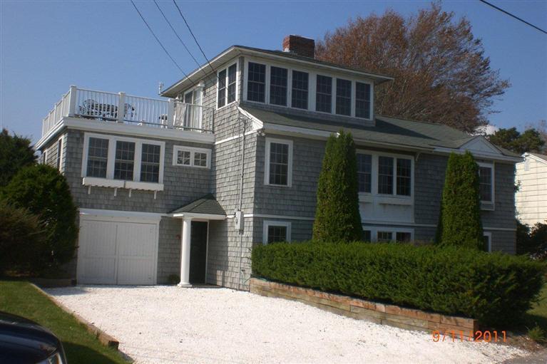 65 Bay Shore Road Hyannis, MA 02601 - Photo 1 of 35 a front view of a house with a yard