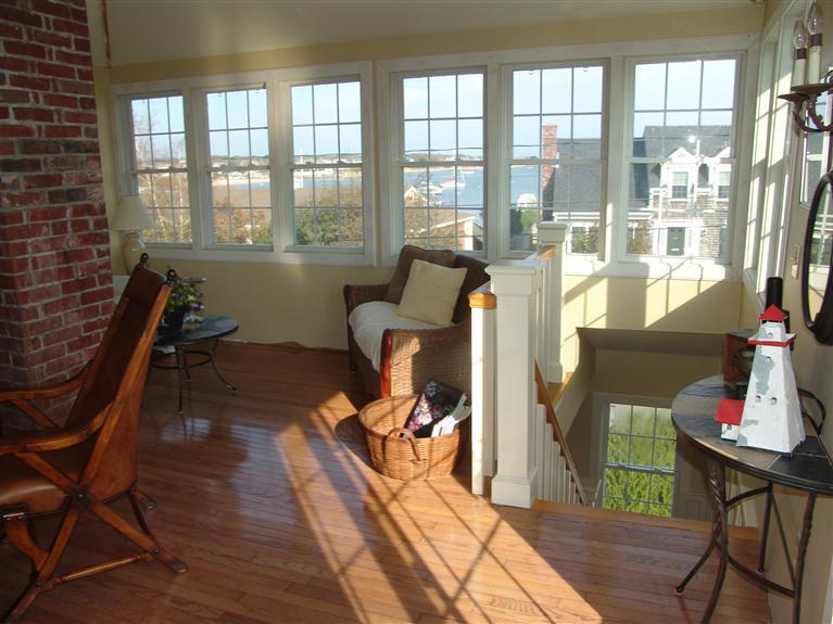 65 Bay Shore Road Hyannis, MA 02601 - Photo 19 of 35 a living room with furniture and a floor to ceiling window