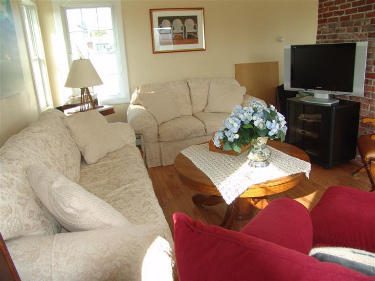 65 Bay Shore Road Hyannis, MA 02601 - Photo 20 of 35 a living room with furniture and a flat screen tv