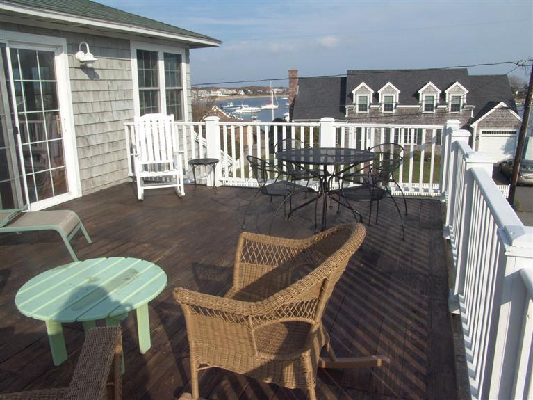65 Bay Shore Road Hyannis, MA 02601 - Photo 21 of 35 a view of a chair and table on the deck