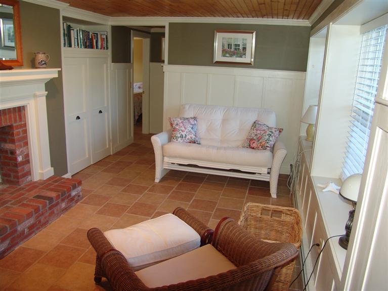 65 Bay Shore Road Hyannis, MA 02601 - Photo 23 of 35 a living room with furniture and a wooden floor