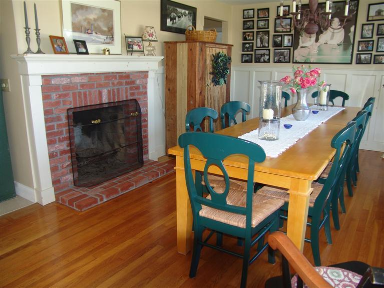 65 Bay Shore Road Hyannis, MA 02601 - Photo 8 of 35 a dining room with furniture and a fireplace
