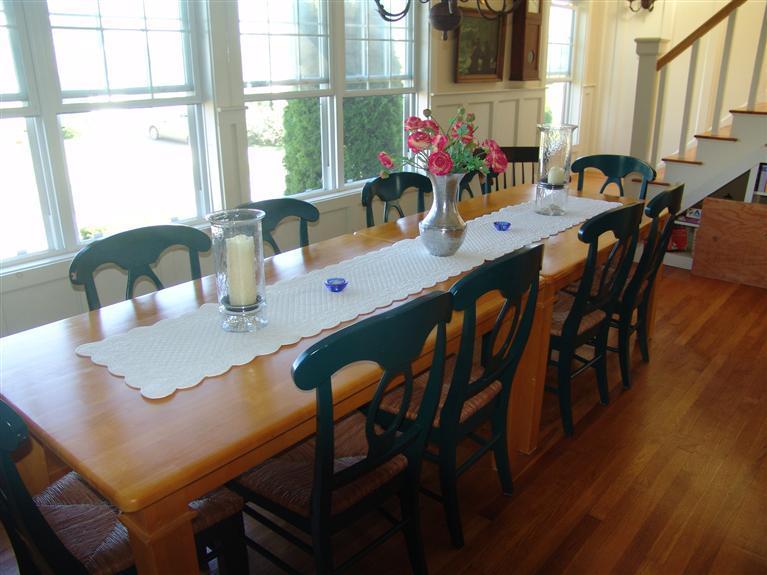 65 Bay Shore Road Hyannis, MA 02601 - Photo 9 of 35 a view of a dining room with furniture window and wooden floor