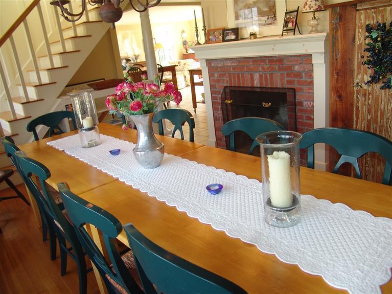 65 Bay Shore Road Hyannis, MA 02601 - Photo 10 of 35 a kitchen with a sink a table and chairs