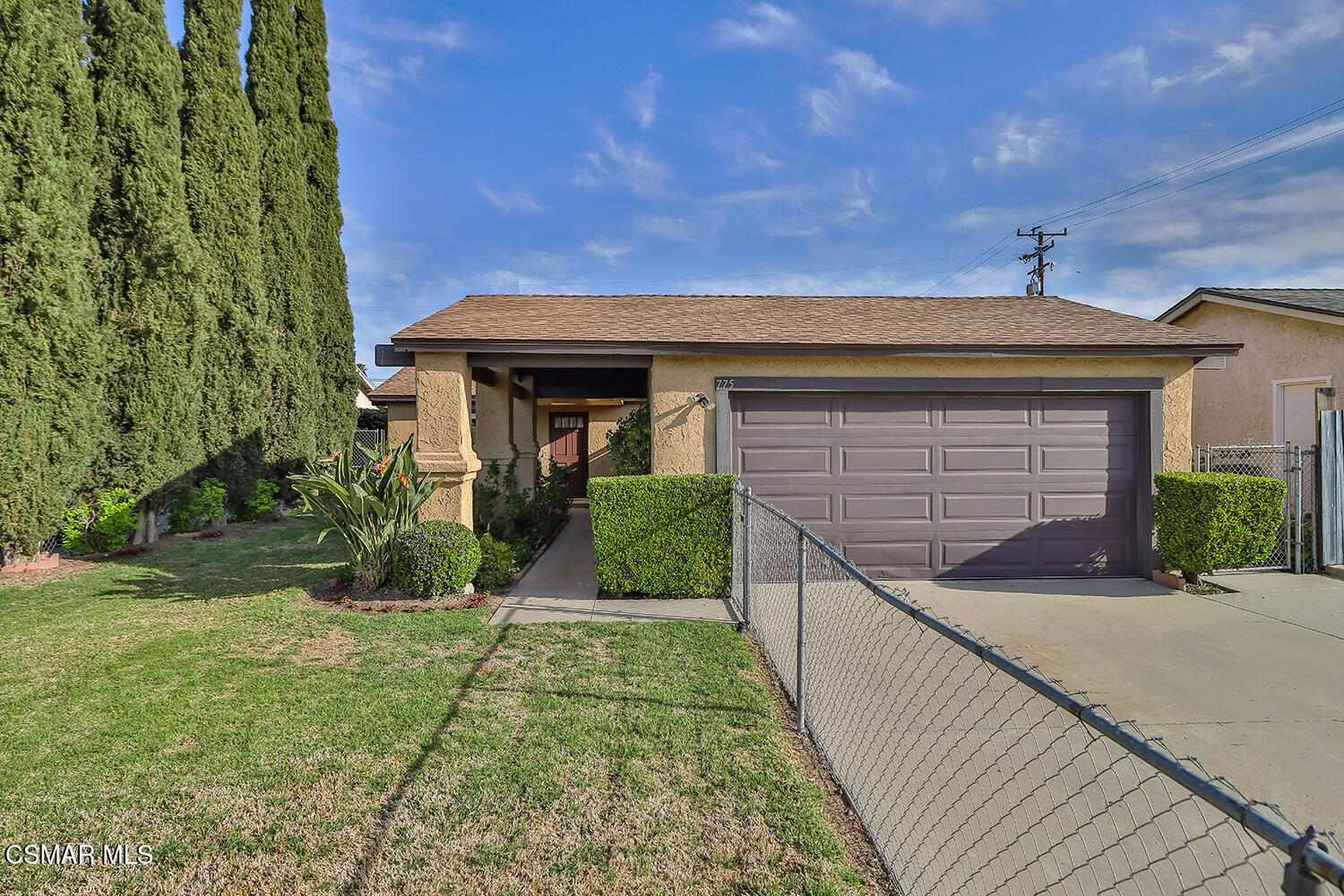 a front view of a house with yard