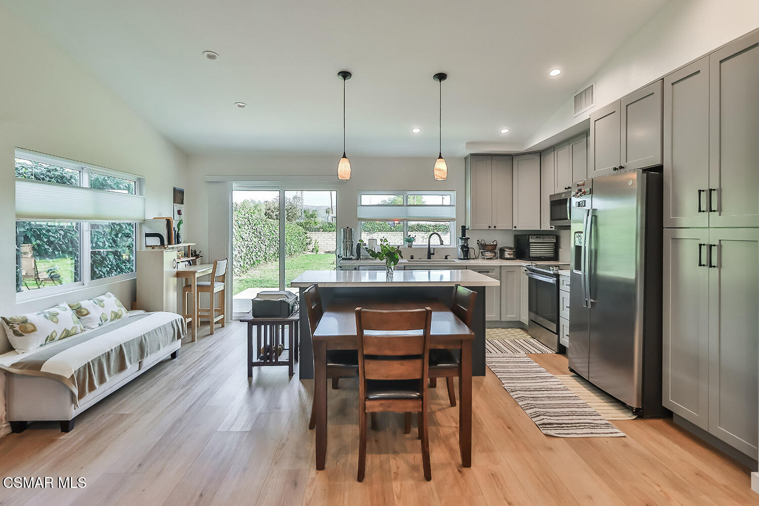 775 Ashland Avenue Simi Valley, CA 93065 - Photo 12 of 36 a dining room with furniture a chandelier and wooden floor