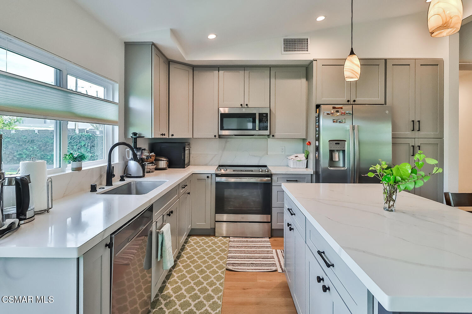 775 Ashland Avenue Simi Valley, CA 93065 - Photo 14 of 36 a kitchen with a sink stove and refrigerator