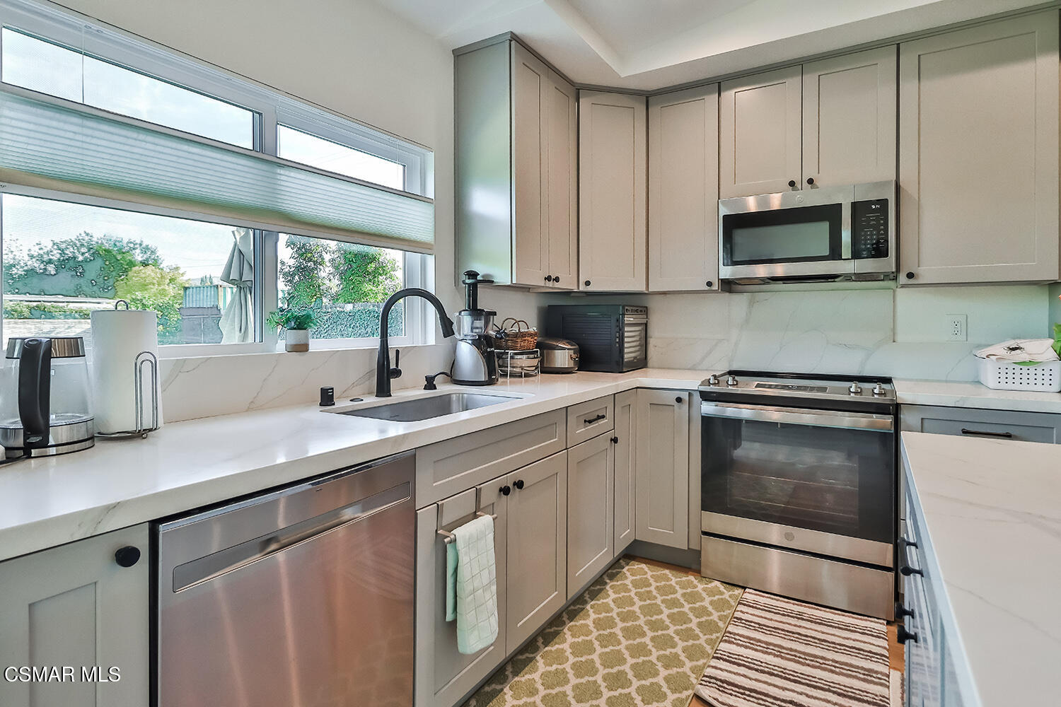 775 Ashland Avenue Simi Valley, CA 93065 - Photo 15 of 36 a kitchen with a sink stove and microwave