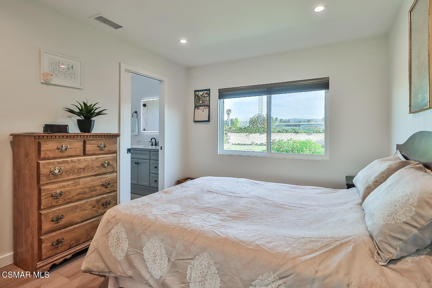 775 Ashland Avenue Simi Valley, CA 93065 - Photo 26 of 36 a bedroom with a bed and a dresser