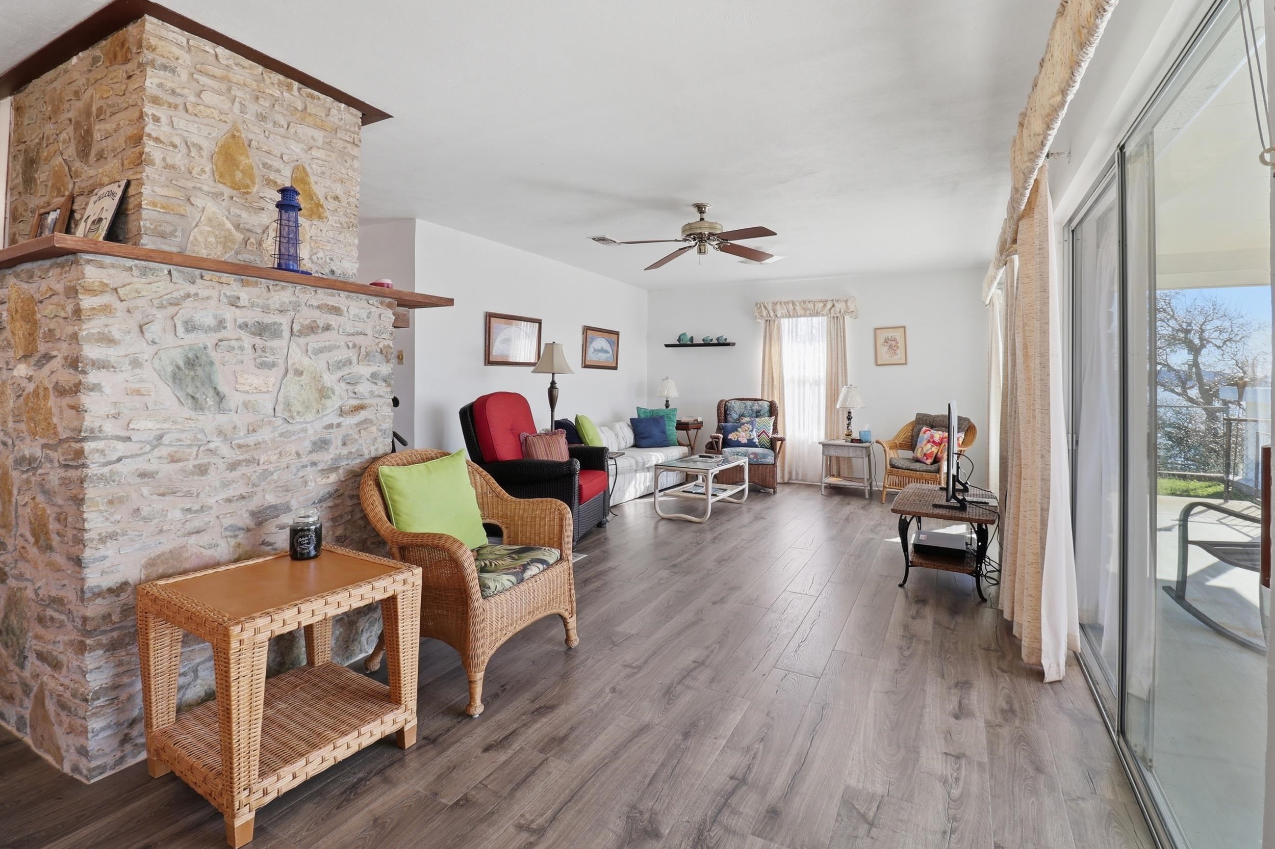 919 Lakeshore Loop Tow, TX 78672 - Photo 15 of 33 a living room with furniture and a wooden floor