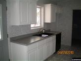 2224 Roundabout Way Overgaard, AZ 85933 - Photo 3 of 4 a kitchen with a sink cabinets and a window