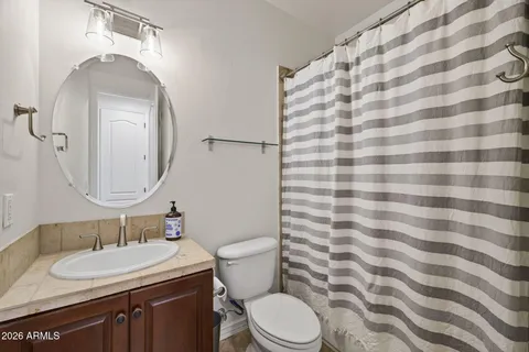 a view of a workspace with furniture and wooden floor