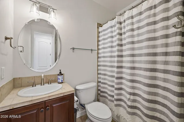 a view of a workspace with furniture and wooden floor