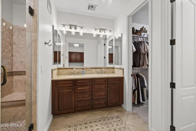 a bedroom with a bed and a television