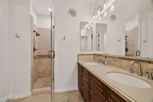a bathroom with a double vanity sink a and mirror