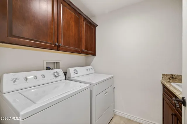 a hallway with cabinets and wooden floor