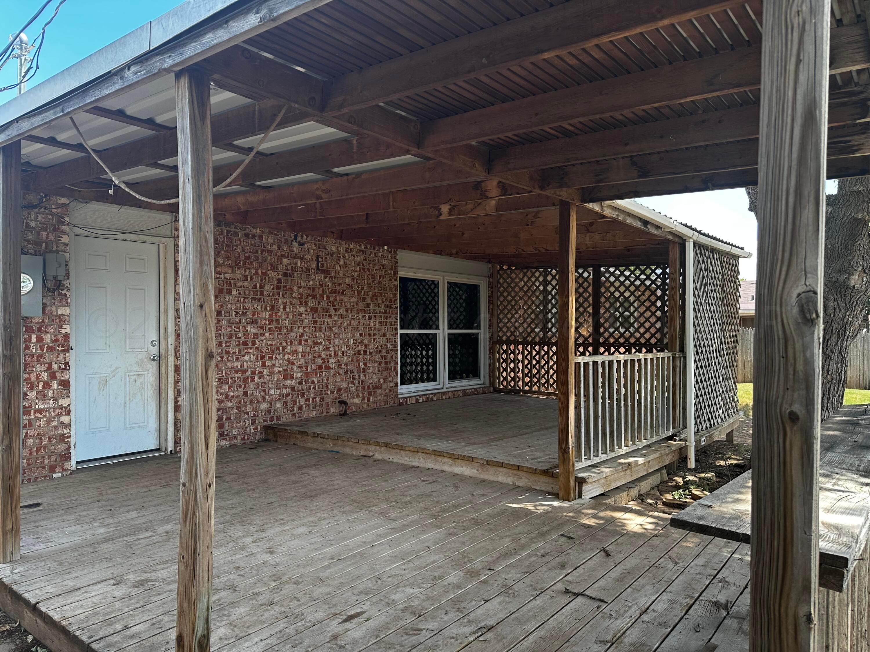 4209 Mesa Circle Amarillo, TX 79109 - Photo 6 of 9 a view of a house with a door and wooden floor