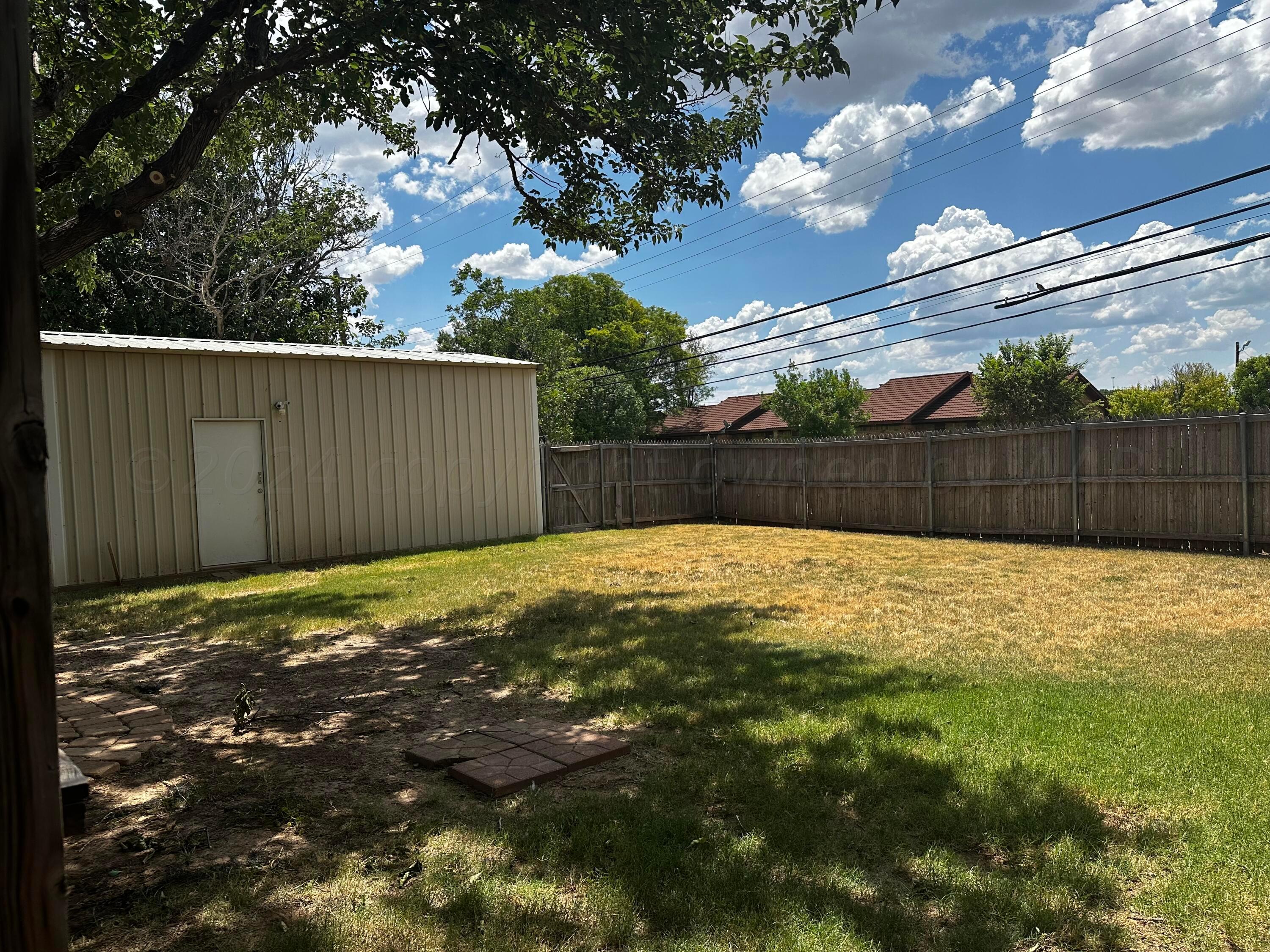 4209 Mesa Circle Amarillo, TX 79109 - Photo 7 of 9 a view of a backyard