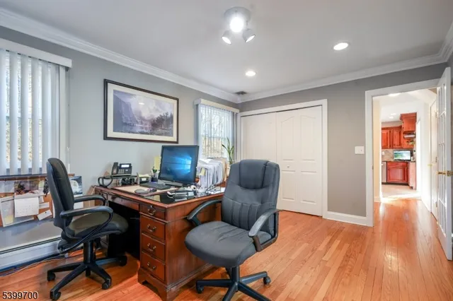 a workspace with furniture and wooden floor