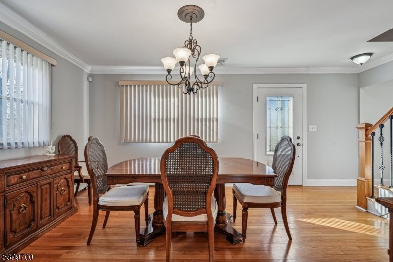 436 Mt Airy Road Bernards, NJ 07920 - Photo 5 of 20 a dining room with furniture a chandelier and wooden floor