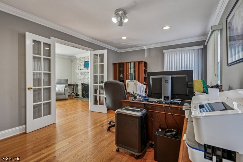 436 Mt Airy Road Bernards, NJ 07920 - Photo 10 of 20 a room with furniture cabinetry and a flat screen tv