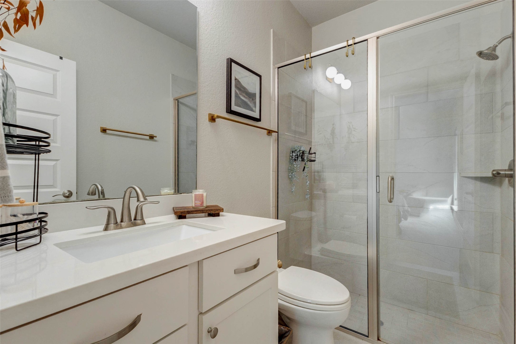 4303 Tupelo Leaf Court Manvel, TX 77578 - Photo 26 of 50 a bathroom with a sink toilet and shower