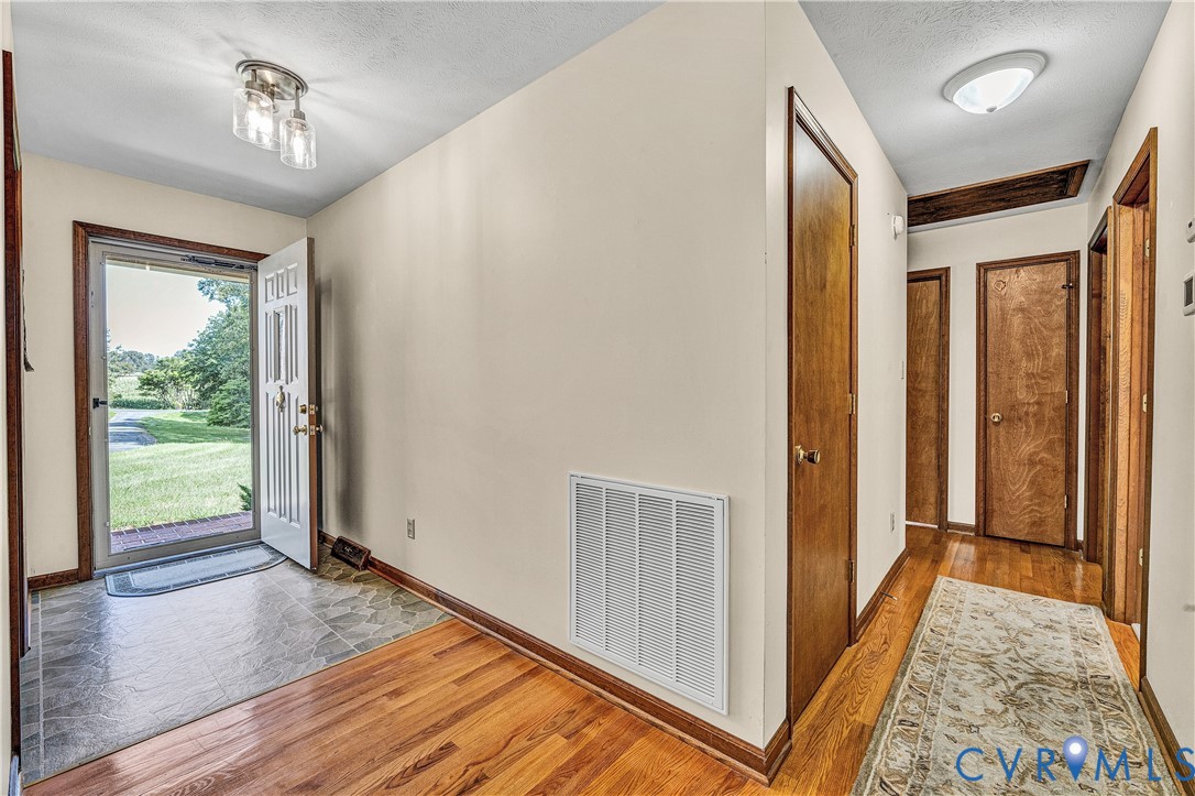 258 Willow Oak Road Appomattox, VA 24522 - Photo 5 of 50 Entryway featuring wood-finish flooring, a two-lig