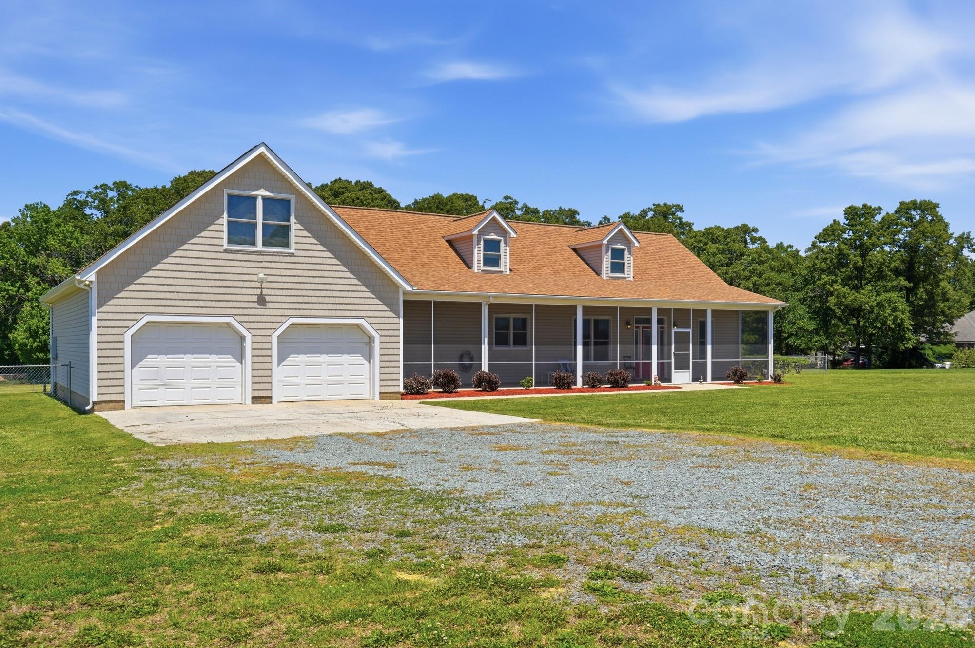 4415 Old Monroe Marshville Road Wingate, NC 28174 - Photo 2 of 28 a front view of a house with a yard and garage