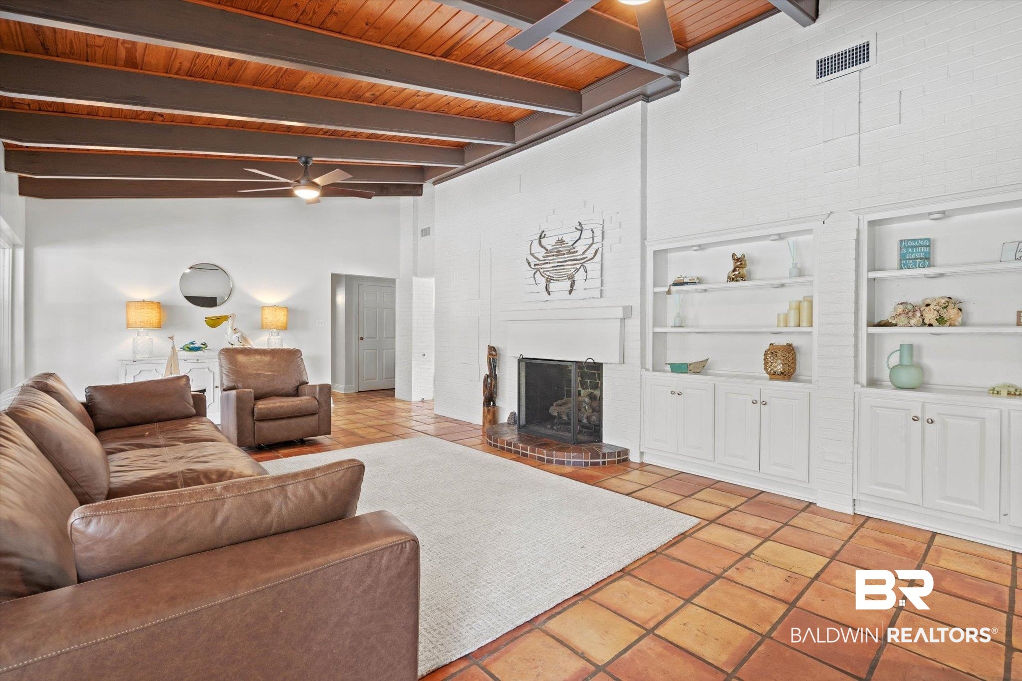 3720 Rabbit Creek Court Theodore, AL 36582 - Photo 4 of 47 Living area with high vaulted ceiling, a wooden ceiling with exposed beams, a brick fireplace, ceiling fan, and built in shelves