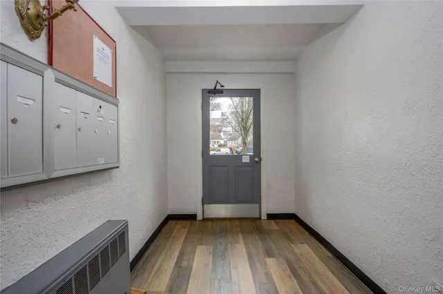 a view of entryway with wooden floor